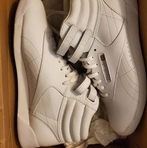 White Reebok classic high top sneakers